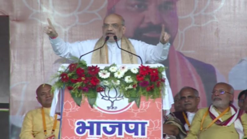 Bihar: बेगूसराय में गिरिराज सिंह का हाथ पकड़कर गरजे शाह, विपक्ष पर जोरदार हमला